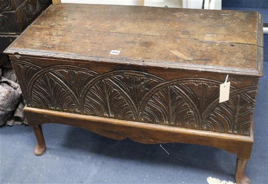 A 17th/18th century palmette-carved oak small coffer on later stand, W 91cm W.92cm